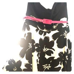 Black white dress with hot pink belt.
